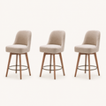 Studio | all three stools at a true three-quarter studio angle, rounded backs and tapered leg profile both reading