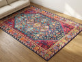 Pennine rug | angled view beside a sofa, showing the border and pile