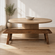 In a room | medium-brown solid acacia dining bench along one long side of a warm oak dining room's round table, window at left