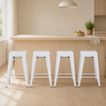 In a room | all four matching gray counter stools at a flax dining room's kitchen island edge, bright midday light from the left