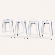 Studio | all four stools at a true three-quarter studio angle, seat depth and X-brace both reading