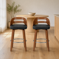 In a room | both matching stools at a warm oak dining room's island edge, soft morning sidelight from the left