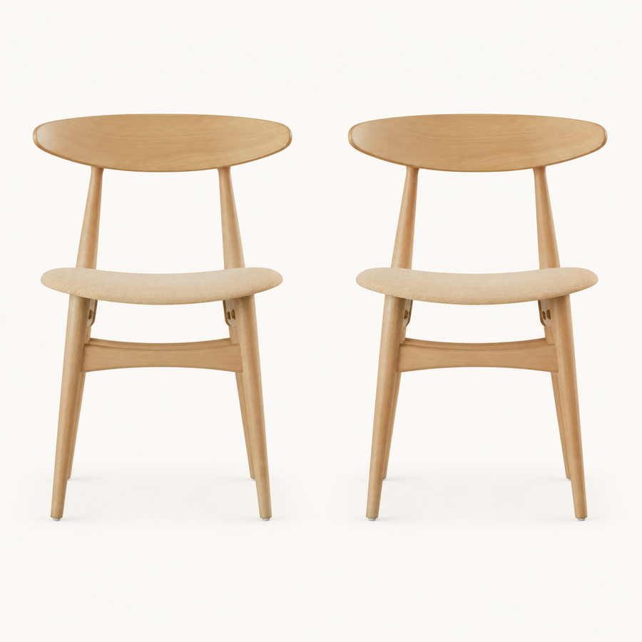 Front | both natural rubberwood side chairs with beige fabric seats centered on paper, curved crescent backs visible