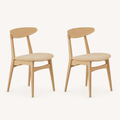 Studio | both chairs at a true three-quarter angle, the crescent back curve and seat both reading
