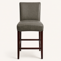 Front | vintage gray faux-leather counter stool centered on paper, four dark cherry-mahogany wood legs and footrest