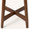 Detail | the leg-to-seat X-stretcher joinery in warm-brown rubberwood