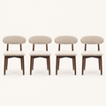 Front | all four beige woven dining chairs centered on paper, oval backs and warm-brown tapered legs