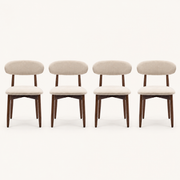 Front | all four beige woven dining chairs centered on paper, oval backs and warm-brown tapered legs