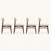 Side | profile view of all four chairs showing the oval back depth and the tapered legs