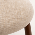 Closer | beige woven fabric texture up close on the seat and back