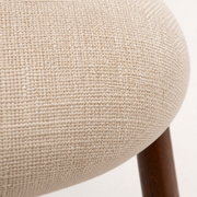 Closer | beige woven fabric texture up close on the seat and back