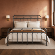 Clay room | Front view against a clay wall with brass sconces, dark wood, and neutral bedding