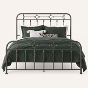 Metal detail | Close view of the headboard and footboard rails, spindles, and circular accents