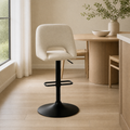 In a room | beige swivel adjustable bar stool at a flax dining room's kitchen island edge, bright midday light from the left