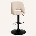 Angle | true three-quarter studio view, the round base plate foreshortened and the oval cutout reading with depth