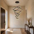 Entryway | the same six-ring cascade hung over an entry console with a dark wood front door