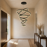 Entryway | the same six-ring cascade hung over an entry console with a dark wood front door