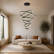 Living room | the six-ring cascade hung over a travertine coffee table and linen sofa