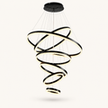 Front | studio front of all six black rings spiraling down from the canopy