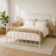 Airy corner | Off-white spindle bed from the corner with morning light, oak furniture, and a pale rug