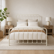 Airy room | Off-white spindle bed in a bright bedroom with oak nightstands, a plant, and linen bedding