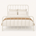 Front | Straight-on studio view of the complete off-white metal frame on a pale backdrop