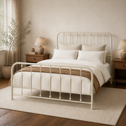 Angle | Three-quarter view of the off-white spindle bed with rounded rails, bedding, and a window