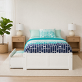 Airy room | White storage bed in a bright bedroom with oak nightstands and a tall plant