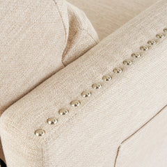 Recliner in Beige Polyester Fabric with Nailhead Trim and Dark Brown Wood Legs