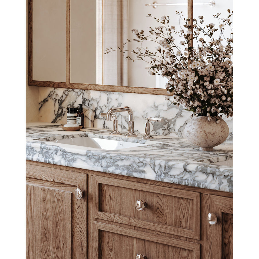 Installed | complete Polished Nickel widespread faucet at a bathroom sink