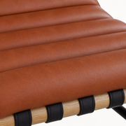 Closer | cognac vegan-leather seat with horizontal channel-tufted ribs