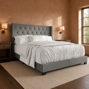 Room 3 angle | Clay bedroom from the corner, walnut nightstands and dark plank flooring
