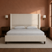 Room 3 | Front view in a clay plaster bedroom with brass sconces and a vintage rug
