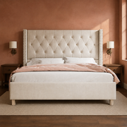 Room 3 | Front view in a clay plaster bedroom with brass sconces and a vintage rug