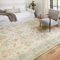 Styled room | the rug in a bright living room with a linen sofa