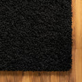 Close up | pile, edge and weave detail on a wood floor