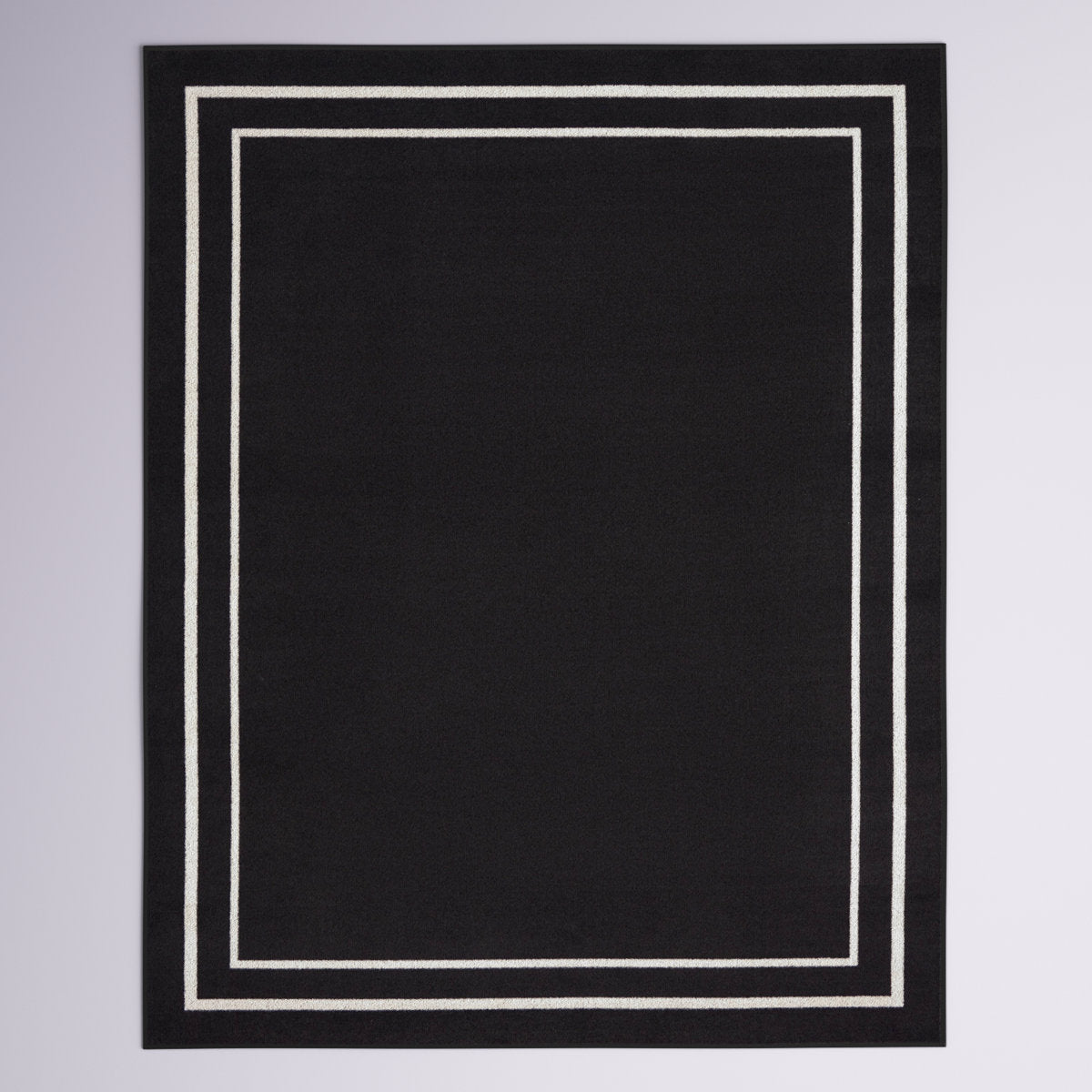 Full rug | the whole rug flat on a plain backdrop, no furniture