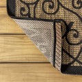 Close up | a folded corner showing the flat weave pile and backing