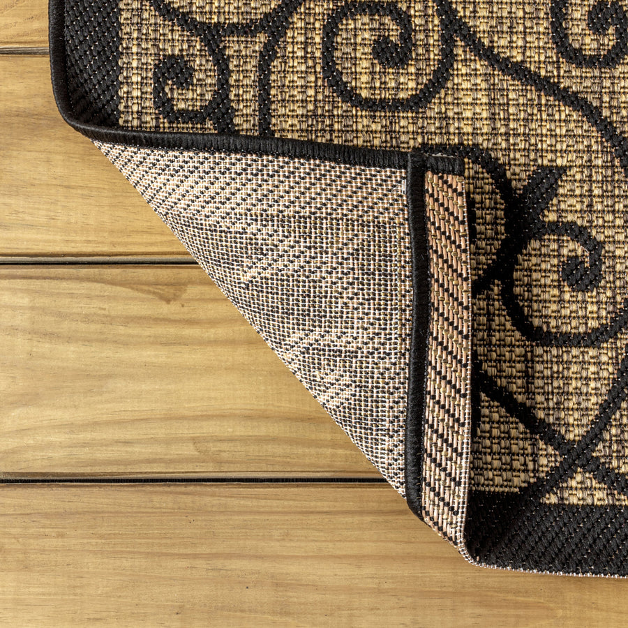 Close up | a folded corner showing the flat weave pile and backing