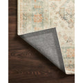 Backing | corner folded back to show the woven backing