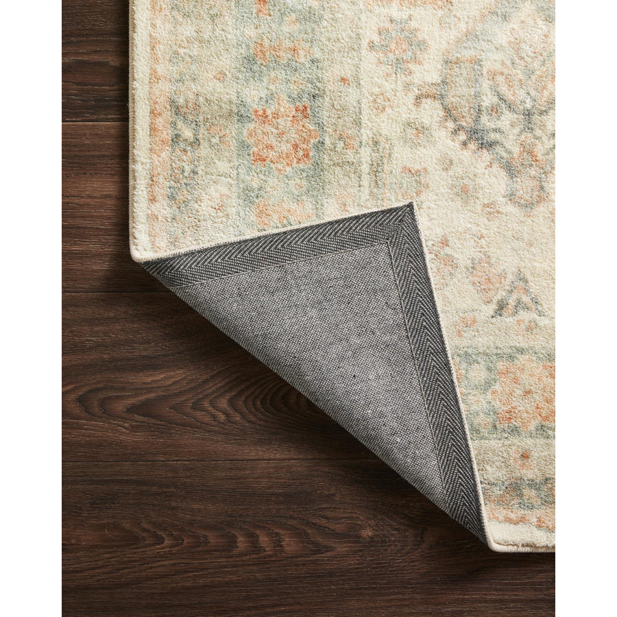 Backing | corner folded back to show the woven backing