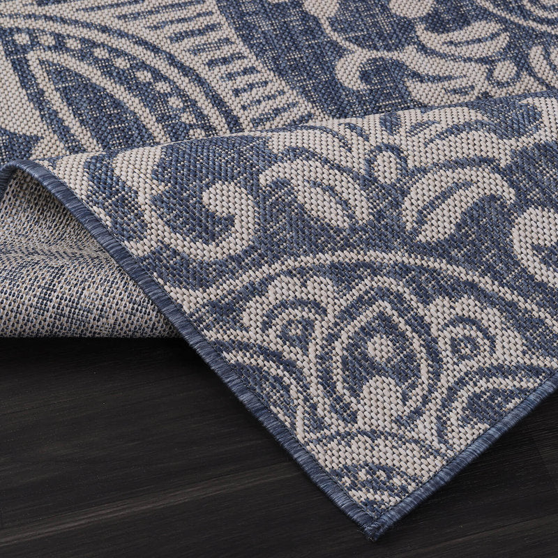 Folded corner | one corner turned back to show the backing and weave