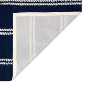 Backing | one corner folded back to show the tufted backing