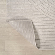 Close up | the carved high-low pile and finished edge, folded to show the backing