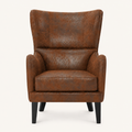 Front | distressed brown embossed faux-leather wingback chair centered on a cream studio ground, dark nailhead trim and black tapered legs