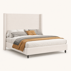 Studio angle | Three-quarter studio view showing the headboard depth, upholstered rails, footboard, and feet