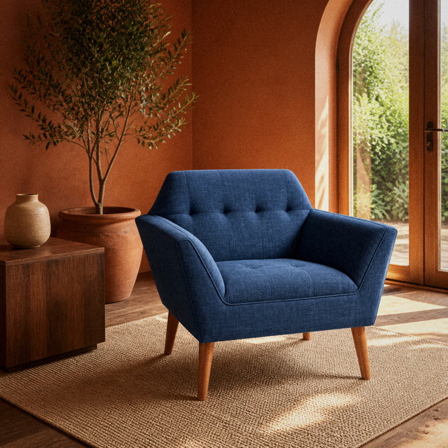 Room 2 | deep navy basketweave armchair in a terracotta room with an arched garden door and plain rug