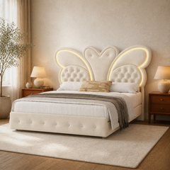 Room 1 angle | Three-quarter bedroom view showing the butterfly headboard, illuminated edges, upholstered footboard, and layered bedding