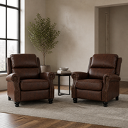 Scale | two reddish-brown push-back recliners beside an uncropped full-height doorway and window reveal, showing room scale