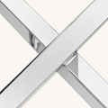Macro | crossed stainless-steel legs meeting at the base
